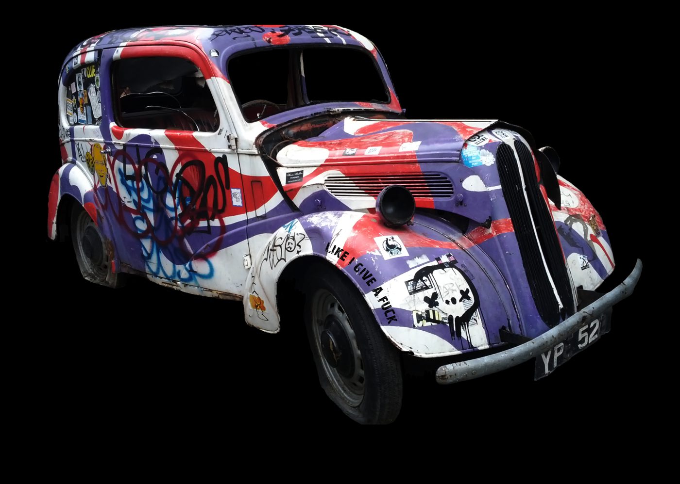 A sticker-bombed 1950s Ford van in purple, red and white, with a Like I Give A Fuck sticker on the front wing.